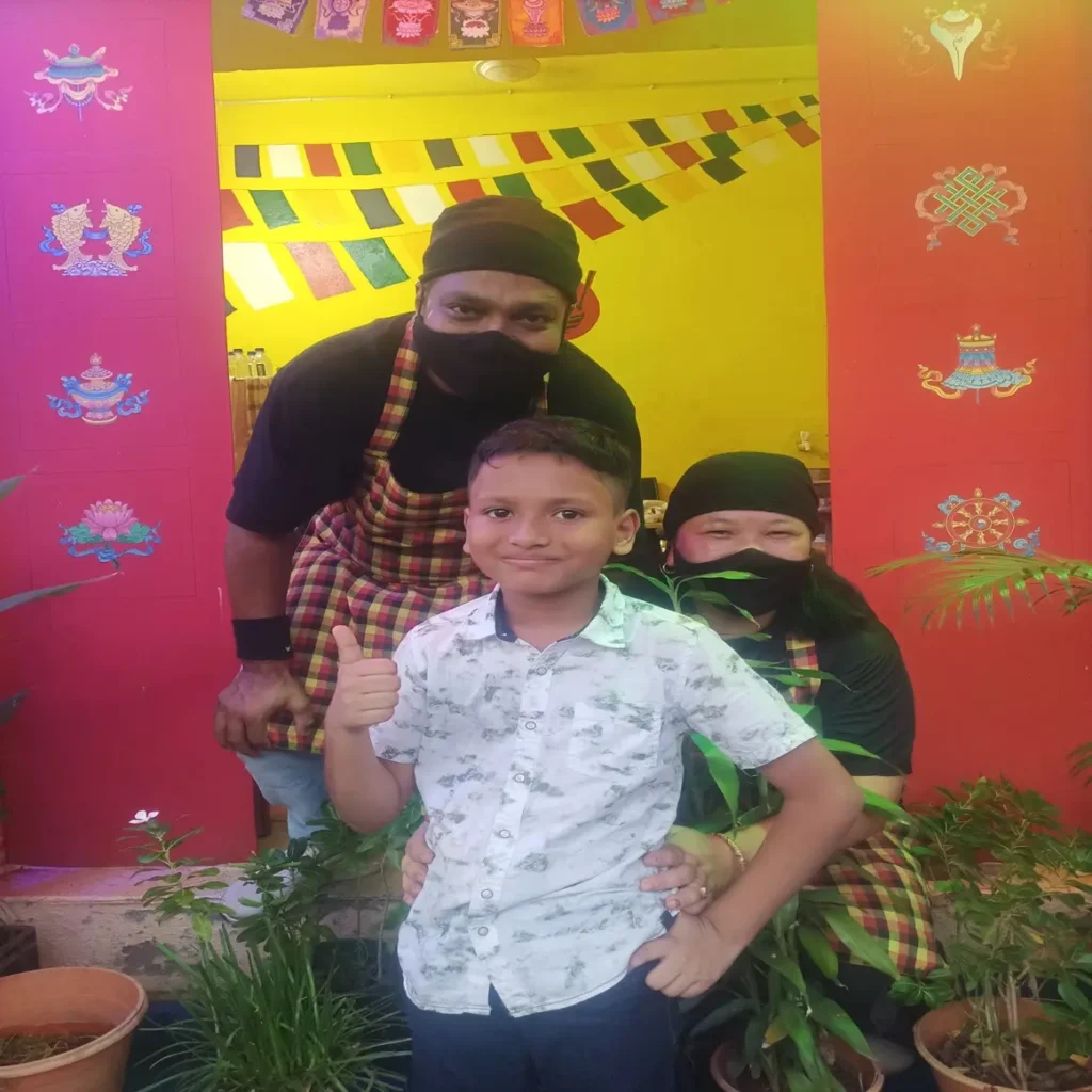 sonams tibetan kitchen's young customer with the owner and chief